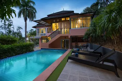 a house with a swimming pool in front of a house at Villa Hillside 2-story-3BR-Private Pool near Big Buddha in Ban Klang