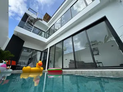 a house with a rubber duck in the swimming pool at Brand new Luxury Pool Villa Seaview Rooftop in Ban Saiyuan (1)