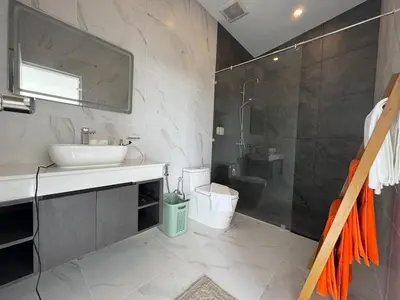 a bathroom with a sink and a shower at Brand new Luxury Pool Villa Seaview Rooftop in Ban Saiyuan (1)