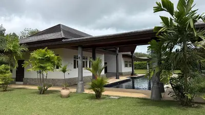 a villa with a swimming pool and a house at The Majestic Estate - 6 Bedroom Private Villa in Ban Bang La