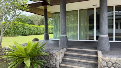 a front porch of a home with glass doors at The Majestic Estate - 6 Bedroom Private Villa in Ban Bang La