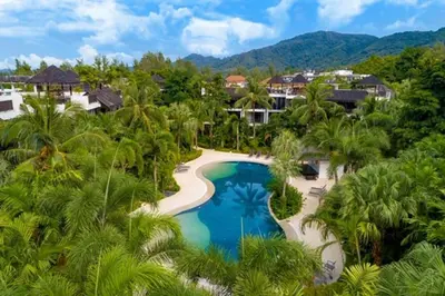 an aerial view of a resort with a swimming pool at Bangtao Beach Gardens - Pool & Garden View Apartment in Surin Beach