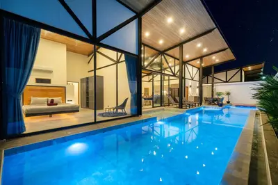 a large swimming pool in a house with a bedroom at NEW! Sleek Design Oxygen Pool Villa 3 BR - Sunset Garden 14 in Ban Saiyuan (1)