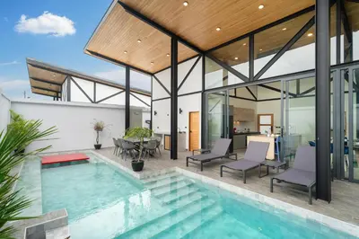 an image of a house with a swimming pool at Stylish Eco Villa Sunset Garden 1E with Private Pool near Nai Harn Beach in Ban Saiyuan (1)