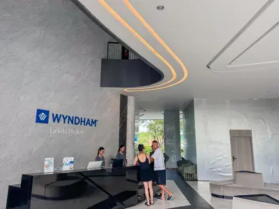a group of people standing in the lobby of a building at Large Lux Studio in La Vita 5-star Rawai in Rawai Beach