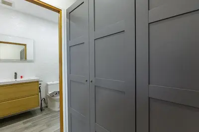 a bathroom with a sliding door with a sink at Modern 4-Bedroom Solar Villa with Pool & Game Zone at Sunset Garden 15 in Rawai Beach