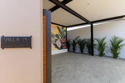 a lobby with plants and a sign in a building at Modern 4-Bedroom Solar Villa with Pool & Game Zone at Sunset Garden 15 in Rawai Beach
