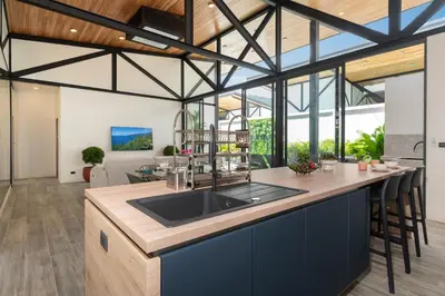a kitchen with a sink and a counter top at Sunset Garden 16 - Eco Design Villa with Private Pool near Nai Harn Beach in Rawai Beach