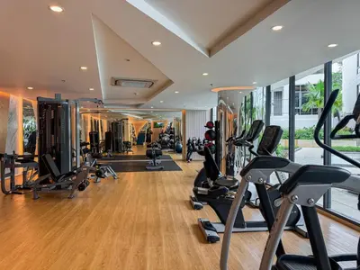 a gym with treadmills and elliptical machines at Luxury 5-star Duplex in La Vita Sea View in Rawai Beach