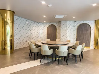 a dining room with a table and chairs at Luxury 5-star Duplex in La Vita Sea View in Rawai Beach