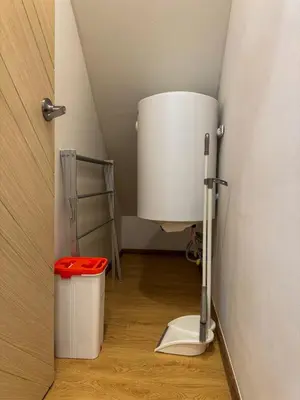 a bathroom with a toilet in the corner of a room at Luxury 5-star Duplex in La Vita Sea View in Rawai Beach