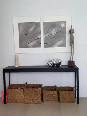 a black table with two baskets and two pictures at Minimalist luxury villa in Ban Klang