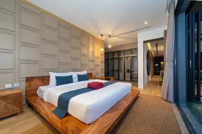 a bedroom with a large white bed in a room at Cocoon Villa 5 - Luxurious 3BR Pool Retreat near Naithon Beach in Nai Thon Beach