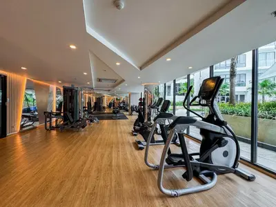 a gym with treadmills and elliptical machines at La Vita Rawai Nai Harn Beach 5 Star 1 BDR in Rawai Beach