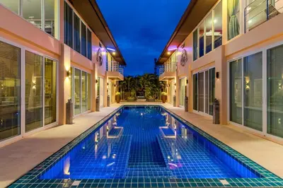 a swimming pool in the middle of a building at V225 Spacious 3BR Villa Pool and Garden Near Beach in Rawai Beach