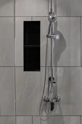 a shower with a shower head in a bathroom at Title Legendary, 1-BR, 45 sqm, 8 min to BangTao Beach in Bang Tao Beach