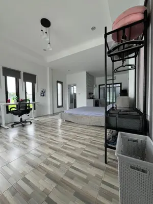 a bedroom with a bed and a bunk bed at Vista Loft Bang Tao in Ban Thalat Choeng Thale
