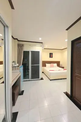 a hotel room with a bed and a bathroom at A&N Residence Patong in Patong Beach