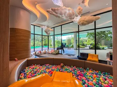 a large ball pit in a room filled with balls at New Modern 1Bdr Laya 500 m to the Beach in Layan Beach