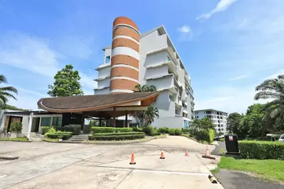a building with a tower on top of it at Spacious studio with access to the pool in Karon Hill condo in Karon Beach