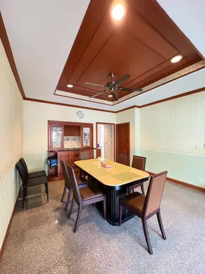 a dining room with a table and chairs at RisaVilla Phuket - 4BR Pool Villa near Patong Beach in Patong Beach