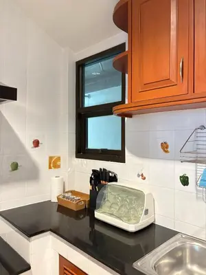 a kitchen counter with a kitchen appliance on a counter top at RisaVilla Phuket - 4BR Pool Villa near Patong Beach in Patong Beach