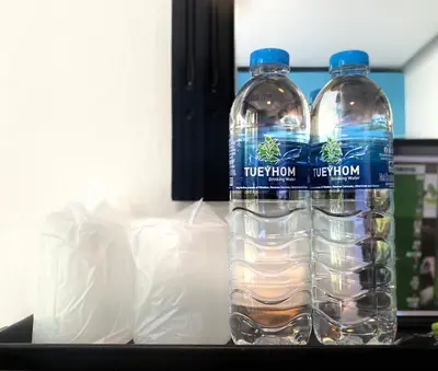 two bottles of water sitting on top of a counter at NR Nanai Patong in Patong Beach
