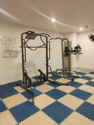 a gym with two tread machines in a room at Relaxing Apartment in Karon in Karon Beach
