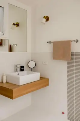 a bathroom with a white sink and a mirror at Relaxing Apartment in Karon in Karon Beach