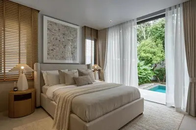 a bedroom with a large bed and a large window at Premium Villa Botanica 3-BR with Pool and Garden in Ban Pak Lak