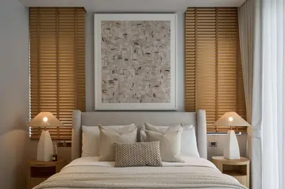 a bedroom with a bed with two lamps and a picture at Premium Villa Botanica 3-BR with Pool and Garden in Ban Pak Lak