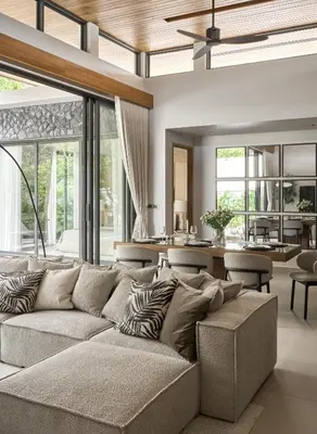 a living room with a couch and a table at Premium Villa Botanica 3-BR with Pool and Garden in Ban Pak Lak
