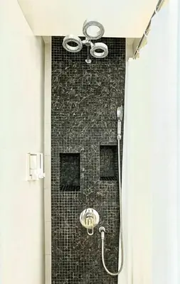 a bathroom with a shower with a ceiling at Stay Kata in Kata Beach