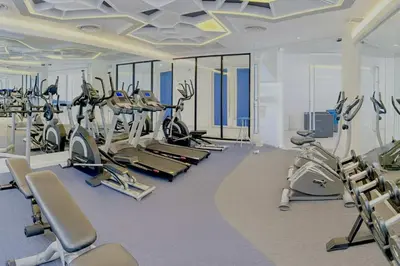 a gym with several treadmills and cardio machines at Stay Kata in Kata Beach