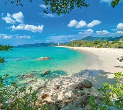 a view of a beach with rocks in the water at Stay Kata in Kata Beach