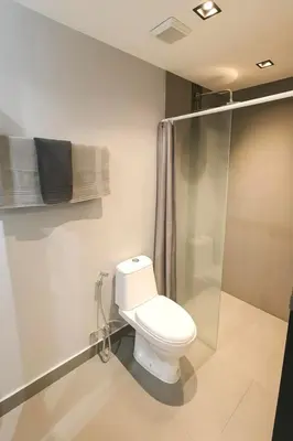 a bathroom with a toilet and a shower at Modern Apartment in Chalong in Chalong