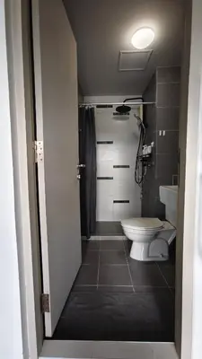 a bathroom with a toilet and a sink at D Condo mine Kathu in Kathu