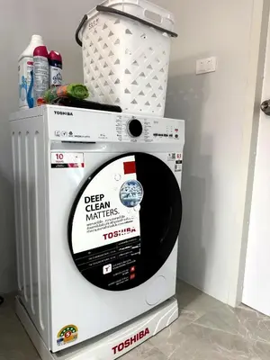 a washing machine with a sign on the top of it at Villa Sea View PanWa in Ko Taphao Noi