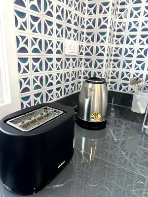 a toaster sitting on top of a kitchen counter at Villa Sea View PanWa in Ko Taphao Noi