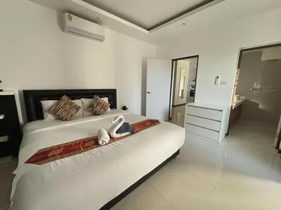 a bedroom with a bed with two towels on it at Villa with private pool in Kamala in Kamala Beach