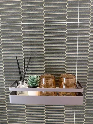 a shelf with two jars and a plant on it at Sea Escape Koh Yao Yai in Ko Yao Yai
