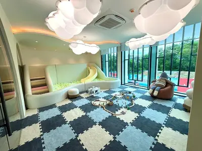 a living room with a couch and a table at The Title Legendary Condo with a large terrace 308 in Bang Tao Beach