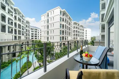 a balcony with a table with a bowl of fruit on it at The Title Legendary Condo with a large terrace 308 in Bang Tao Beach