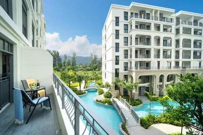an apartment balcony with a view of a river at The Title Legendary Condo with a large terrace 308 in Bang Tao Beach