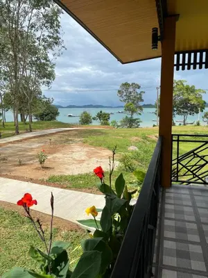a porch with a view of the water at SeaMountain Kohyao Noi in Ko Yao Noi