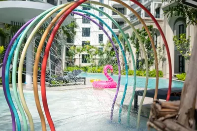 a pool with a pink flamingo in a water park at The Legendary Apartment 408 in Bang Tao Beach