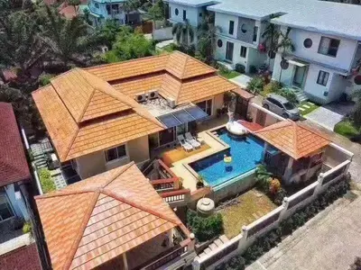 an aerial view of a house with a swimming pool at ZJ Garden Pool Villa in Phuket Town