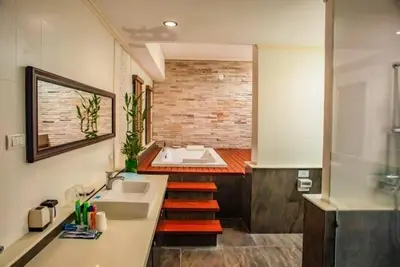 a bathroom with a sink and a bath tub at ZJ Garden Pool Villa in Phuket Town