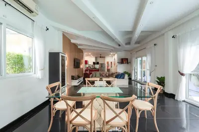 a living room with a table and chairs at Platinum Villa Rawai 76 in Rawai Beach