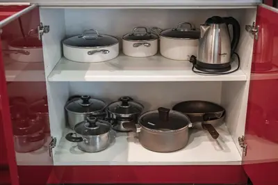 a group of pots and pans on a shelf at Platinum Villa Rawai 76 in Rawai Beach